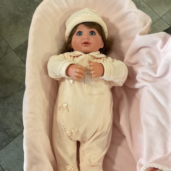 Adorable Baby Doll with Blue Eyes and Pink Outfit - Picture 3 of 7